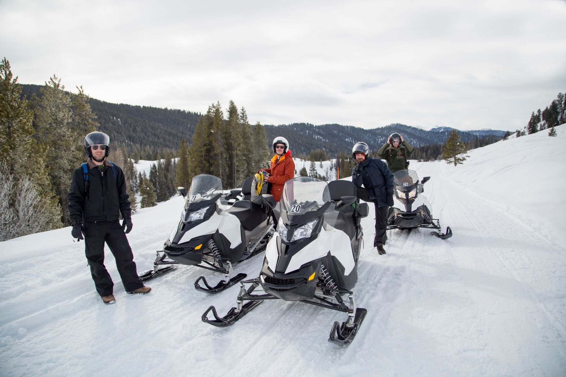 Friends on snowmobile, Jackson Hole, Wyoming